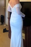 This small fit perfectly.  If I keep it, I would probably bring in the mesh sleeve a little in the back, as the dress is clearly made to either sit off the shoulders or on them.  I love the structure in the bust!  Very good quality material as well.  This is definitely in the running for my dress. - Sarah B.