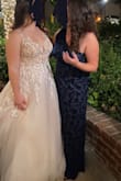 I had my doubts, but she was so cute!! I felt so regal and also not too exposed! Didn't know there was a slit! Sat really well on my body, was flowy just the right amount! The side with no shoulder sleeve had a little latch above the zipper to keep the dress together and that kind of bothered me as it kinda poked a little but aside from that, no nip slips, wasn't too tight, and perfect length! - Rachel B.