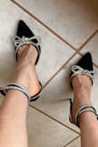 The sizing is definitely true to size but I ordered bigger because someone said the sizing is small. I would love these shoes if the straps had more holes. Also, when you close the straps, some of the glued diamonds tend to come off. - Emilia L.