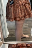 It's a cute dress however if you are a pear shaped figure do NOT BUY! The ruffles going horizontal add too much volume to the hip area and if you have a larger bum it will be too short, this was super short on me, I can do short but this was too much. bummed cause I wanted to love this, Im returning it. As reference, I'm only 5'4. - Maria M.