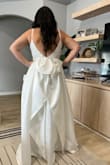 This dress was very pretty but not the one I chose. It did not hit my waist in the right spot but is still very elegant and a great material! Loved the bow in the back as well! - Felicia E.