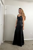This dress was a perfect fit that I needed for a black tie wedding! It's fitted all the way down to my mid-thigh and then fans out a little to make the skirt a nice long length. Perfect for showing just a little of my shoes and being a floor-length dress. There is also boning under my arms on each side to offer support in the bust; Great touch! - Abigail M.