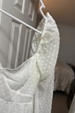 I definitely got someone's stained, used, dirty return. I absolutely loved the dress and before I tried it on I saw gross yellow pit stains and what looks like makeup on the sleeve and more yellow down the back. So nasty :( - Olivia R.