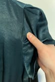I am so disappointed in this jumpsuit. I purchased it for a work holiday party, and after one wear, there are holes in both sleeves and along one of the legs. The material is extremely thin and cheap, and the fraying is so bad that I'm not sure it can be repaired, making it unwearable. The material also attracts a ton of static - when I put it on, the material clung to my legs in a super unflattering way. Save your money, as you can honestly get something from Amazon for a fraction of the cost that's more solidly made than this jumpsuit. - Sarah G.