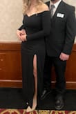 The material is great quality and has a nice stretch to it. I was worried about the front sliding down, but it has a gripper strip that keeps it secure. Length was perfect at 5'6 and 2 inch heels. Really flattering. Slit would rise a bit when I walked, so I had to give it a tug down once in a while. - Lacey W.
