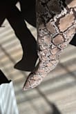 I was looking for a snake print boot and these are cute. They look just like the picture and the calf size is just right. They are comfortable to wear all day. I got them on sale which was nice, too. They are a bit challenging to get off and on, but I just allow myself extra time and get ready to sweat. They do not have a zipper, but there is a tiny bit of hidden stretchy material in the ankle area. I roll down the top while putting them on which creates a handle for me to grab them and pull them up better. I ordered my usual size 11 and they feel great. I have a muscular calf and these fit me just right, I usually only buy wide calf boots. They might be too wide for someone with thinner calves unless you like an oversized calf look which is trending. I am 5'10" and they come up pretty high on me; right under my knee. I would buy them again in multiple colors. - Danielle C.