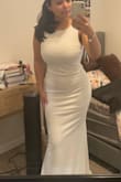 At first glance, this dress looked like it wouldn't fit me, but it fit like a glove. I'll have to find a bra that doesn't show the outline, but honestly might just go braless with nipple covers because that's how good it supports (I have 34DD girls). The bottom is of course big but a wedding dress will always kind of do that so be weary. I wasn't wearing my heels in the pic so it definitely would help. I am IN LOVE though. The quality gives off "bridal boutique wedding dress" for a more affordable price. - Michelle T.
