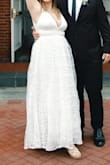 This dress was just the right amount of elegance and simplicity for my small courthouse wedding. It was very long so I had to hem it before the big day. Fit my breasts and make them look great! I'll likely wear this again for a vow renewal. - Jennifer C.