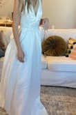 This dress was amazing!! The bow and the slit just made the dress. I wish it fit better because I would have kept it! - Elyssa H.