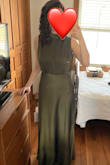 I purchased this dress mostly because it was bra-friendly, which is a huge plus for me. The material is thicker than a lot of satin. I do think it runs slightly larger, but I wouldn't size down. I'm usually a small, but a dress with no stretch is sometimes a medium on me because of my hips. I went with small, and it was definitely the right choice. - Casey W.