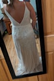 This dress style is hands down what I am going to wear for my wedding. The beading it absolutely gorgeous, and the way the beads flow on this dress gives you the shape that accentuates all the right curves. The reason why I said yes to the style is, I was debating whether I would be a small or a medium. I ordered the medium first, and lo and behold, it is just a little too big. I would say that the medium does fit true to size, but just not my size. I was on the edge of being a small or a medium. This dress does not have any stretch to it so that why I sized up. I have now ordered a small and will be returning the medium. For all you short gals out there, you will have to have the dress hemmed up or will have to wear some tall heels. The straps are on the thinner side, and the straps shorten to the front of the dress. The dress has a super soft interior slip, and the beading under the arm is low enough that they won't cause irritation. Buy this dress!!! - Macy F.