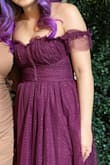 I love the dress and the design! The color leans towards purplish burgundy, and the only con is that the off-shoulder strap is too tight that it rolls up whenever my arms move (as seen in the second pic). - Tracey A.