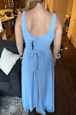 Fits true to size but the cinched part didn't hit me on my natural waist. I will tie the bow a little lower so I don't look like a rectangle and it'll still work. Beautiful color and supportive. I won't need to wear a bra and I typically need to. - Laura R.