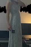 I like the design of this dress a lot! I can see why people would say the material is cheap, but I would be happy wearing it without feeling cheap or anything like that. Although, for the price, one might expect something to feel a bit more sturdy. Either way, if my body fit the dress just a little bit better than intended, it would've been perfect, but I think my bust was just a bit too big and I was a bit short. It was a cute length as a small (though longer than on the model, it was a few inches above the ankles), but the medium was basically a maxi on me (to the ankles) and the 'hip' shape of the dress was a bit too low. I exchanged the S for a M because my bust looked a bit awkward being larger than the sewn in cups, but the medium was too loose. The cups are also purely aesthetic, but nothing a strapless bra couldn't fix, BUT my boobs were still bigger than the dress suggested they should be. The S ~just~ barely fit, but I would've kept it if the bust fit better. :( - Katie J.