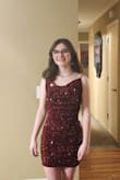I purchased this dress for my daughter for her junior high Valentine's dance. She loved it from the moment she received it!! The material is slightly stretchy, but it literally and beautifully fit to a T!! The sequins are shiny and stitched perfectly so no issues with those. She had a wonderful time at the dance and looked absolutely gorgeous!! - Nikki C.