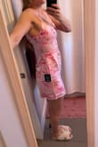 I am an athletic build and a little curvy around the waist. I have very broad shoulders as well. I did order a size too small(no mediums left). The material and design are both great.  Unfortunately, it is very tight around the hips and thighs but noticeably loose around the lower belly area. I think this would be an issue even with the medium. It is also tight around my rib cage area, but I don't think this would be an issue with a medium size. The material does not stretch at all. I think I will bring it in to get tailored though because it would look sooo cute if it fit properly. I think this dress would fit well on a petite-sized person. - Jenni