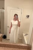 This dress is very plain, but the back is very beautiful! Runs a bit big in the top front. Not my style but the back is so pretty - Hannah S.