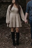 I bought this because I was looking for something to wear to my engagement shoot. I wanted something cute and neutral. The dress is actually heavier than I thought- it kept me warm in 50 degree weather! It was a little baggier, and I'm between sizes so I could have gotten away with sizing down versus sizing up. The photos turned out great! - Roopal K.