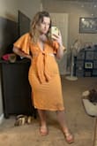 Love this dress! It fits perfectly, not too tight and not too big. You can tie the front, and I was able to tie it to fit my not-so-chesty area. There were a couple of loose threads in the back by the zipper - Presley C.