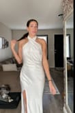 I am OBSESSED with this dress. It is so flattering and fits so well. I dont feel constricted or the opposite (like its going to fall off). I am seriously so happy with this purchase. I will be wearing it at my rehearsal dinner and I cannot wait. The open back is perfect and the high neck line is chefs kiss. - Sydney H.