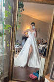 I had been eyeing this dress for months ever since I got engaged. When it was finally back in stock I jumped at the chance to buy it. The 4 fit me perfectly with a bit of room to even take in. It is very long so it would need to be hemmed. I ultimately decided to return this dress as I felt it didn't flatter me the way I wanted it to. It made me feel boxy and the dress was very heavy which is not what I wanted. Otherwise, I love the embroidered detail and the slit. - Jenny L.