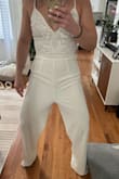 I am 5'5 and this fit perfectly from the waist up. Love the adjustable straps and the non-see-through fabric. My gripe with this is the length of the legs and the torso. Whose torso is that long?! It sagged down to my mid-thigh, and the legs were so long... I'm not that short. I'm of regular average height and a muscular build. I got it on clearance so I brought it to a tailor to see if they can fix it so it's wearable for my bachelorette, but as of now, it's saggy and way too long to even wear with very high heels. - Sara G.