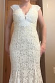 This was truly beautiful. My original order had a sewing error in the skirt underneath, but I was able to exchange the dress. The new one got shipped super quickly and arrived in time for my wedding. The dress fit great to size. No alterations needed. It was comfortable. No complaints. Received so many compliments - Anne L.