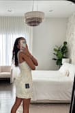 The dress looks so cute on the model but I wasn't a true fan of the material. - Mara S.