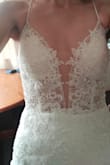 Overall, I liked it! The quality is not bad for the price. The top has very nice details. The open back is great, but it felt too revealing for me. The length is good (I'm tall). It has too much glitter for me, and it makes the skirts feel a bit rigid. If you love glitter, I think you'll love this one.
Otherwise, you might want to keep browsing. - Maria N.