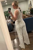 I didn't even end up wearing this jumpsuit but loved it so much that it was worth writing a review. I had this on hand in case I wanted to change for dancing, but it's an awesome fit, stretchy in all the right places, and beautiful detailing. - MEGHAN F.
