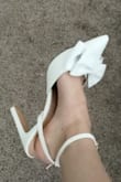Came carefully wrapped and protected. The slimmer block heel helps elevate the shoe but is still easy to walk in. I made an extra hole in the straps so it was more secure for when I walk down the aisle. I'd wear these out on a date too! - Melissa D.