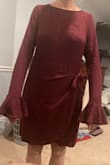 I don't like the way it looks on me. It's not flattering and more old-lady-looking on me. The sleeves are way too long and the top of the wrap hangs. - Chantal F.