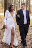 I love the way I look and feel in this dress, used it for engagement photos. The slit seems to be in the middle of the dress so be careful about how you walk and sit. I did use a pin in the middle of the bust because I was a little concerned about gapping. I didn't wear anything underneath and felt supported enough. Loved it for photos, might be too high maintenance for an actual event in my opinion. - Dorian B.