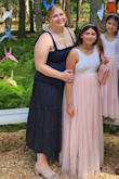 This dress is absolutely amazing! I wore it to two hot summer weddings and remained very comfortable throughout both events. It is a nice material where it doesn't feel cheap but also isn't too heavy. I did not need to wear a bra with it either. I was a little worried about relying on the tie straps to hold the dress up but I never had any issues with them slipping or coming loose. Love the length, color, and flowy-ness of the dress! I got so many compliments on this dress. - Rebecca R.