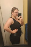 This dress is a nice comfortable, stretchy material. The ruching of the dress does help to hide the tummy area which is a plus. I am not a huge fan of the short slip underneath, I am worried it would slide up while dancing and cause the bottom of the dress to be see-through. Ultimately for me, I had to return this dress and go with another dress that hides an area I am self-conscious about (my upper arms). - Rebecca R.
