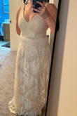 It did not flatter my figure at all. It fits rather well though; chest looks excellent. I almost settled with this one until my sister took me out to try on wedding dresses, and I ended up finding the one. I was not really a fan of the tulle on the outside either, felt it took away from the design. Was considering removing the outer layer before I returned it. Something to consider. - Nichole S.