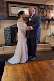 Dress was stunning absolutely was perfect for our small intimate wedding. Sleeves were a little small and hard to lift my arms in. My only issue was the zipper it took three people to get it to zip, it kept getting stuck, I did read the reviews beforehand so I had pins ready in case it ripped but thankfully it didn't. I had a sparkle belt added for some bling. - Jennie V.