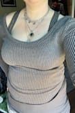 I was disappointed when I first tried it on but now it's not too bad. I wouldn't feel comfortable wearing this shirt without a tank underneath. I ordered a large and it fits great everywhere but the neckline is way too wide. This makes it fall off the shoulders but it doesn't look right because there are shoulder stitching and shaping so you can tell it is meant to be on the shoulders. - Anna H.