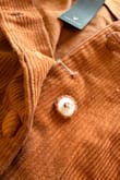 I literally just got this skirt and unbuttoned the skirt to put it on. The button already fell off. Plastic butting with the material over it. The sewing isn't strong out all for the buttons. Be careful. - Janelle G.