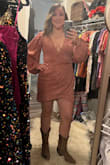 It's a little short, but the material looks way better in person and has sparkly gold threaded lines throughout. I got lots of compliments on this dress! - Brittany H.