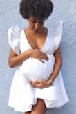 This was the perfect dress to debut my bump in! I am a size small and I sized up to medium. Perfect and comfortable and I received many compliments! - Jazmynn T.