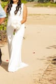 The dress was perfect. It was simple and inexpensive (which was great because it poured 2 hours after my ceremony). I had a beach wedding; the dress was lightweight and easy to move around. - Jay M.