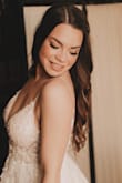 This dress was absolutely beautiful and exactly as pictured. - Laura F.