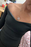 It is squeezing, rides up almost immediately and the boobs area shows the rubber. - Shenae R.