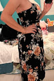The dark navy and flower pattern are beautiful. Dress is too revealing for my age and taste. - Cindy H.