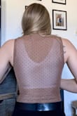 I love the feel of this top, it is very comfortable and soft. It fits well but it is just a smidge on the tight side, however, not uncomfortably tight. The only problem I have with the top is that the back is mesh, which prevents me from wearing my comfy bras with this top. Overall though, this top is cute, well fitting, and can go with anything! - Emma P.