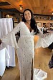 I LOVE this dress! I wore it for my bridal shower, and people genuinely believed I was getting married right then and there. The fit is quite fitted, but I wouldn't go up a size. The details were beautiful, and it's really great quality. I highly recommend this dress! - Bushra M.