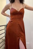 The dress is as pictured. Beautiful rusty color with a thick silky material. Definitely will need to wear heels and may hem it a bit. Bought for a wedding. - Rachael R.