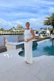 I am 6 months pregnant and this dress was perfect. It's truly stunning and has enough elasticity to fit very comfortably with my growing baby bump. It is long. I am 5'10 and the length with flat heels was perfect. - Laura Q.