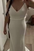 This dress is exactly what I was wanting for our upcoming vow renewal... It is absolutely beautiful! I like the simple, classic style, and I especially love the button details on the back, as I also had those on my actual wedding dress 10 years ago. The material is soft and comfortable with a slight bit of stretch. I am having a few alterations done (hemming since I'm short and having the straps sewn. While it's nice that they are adjustable, I didn't like that the hardware to allow it was so visible, but these are minor things and just personal preference). Overall, I'm very happy with this dress, especially for the price! Thank you, Lulus!! - Lee E.
